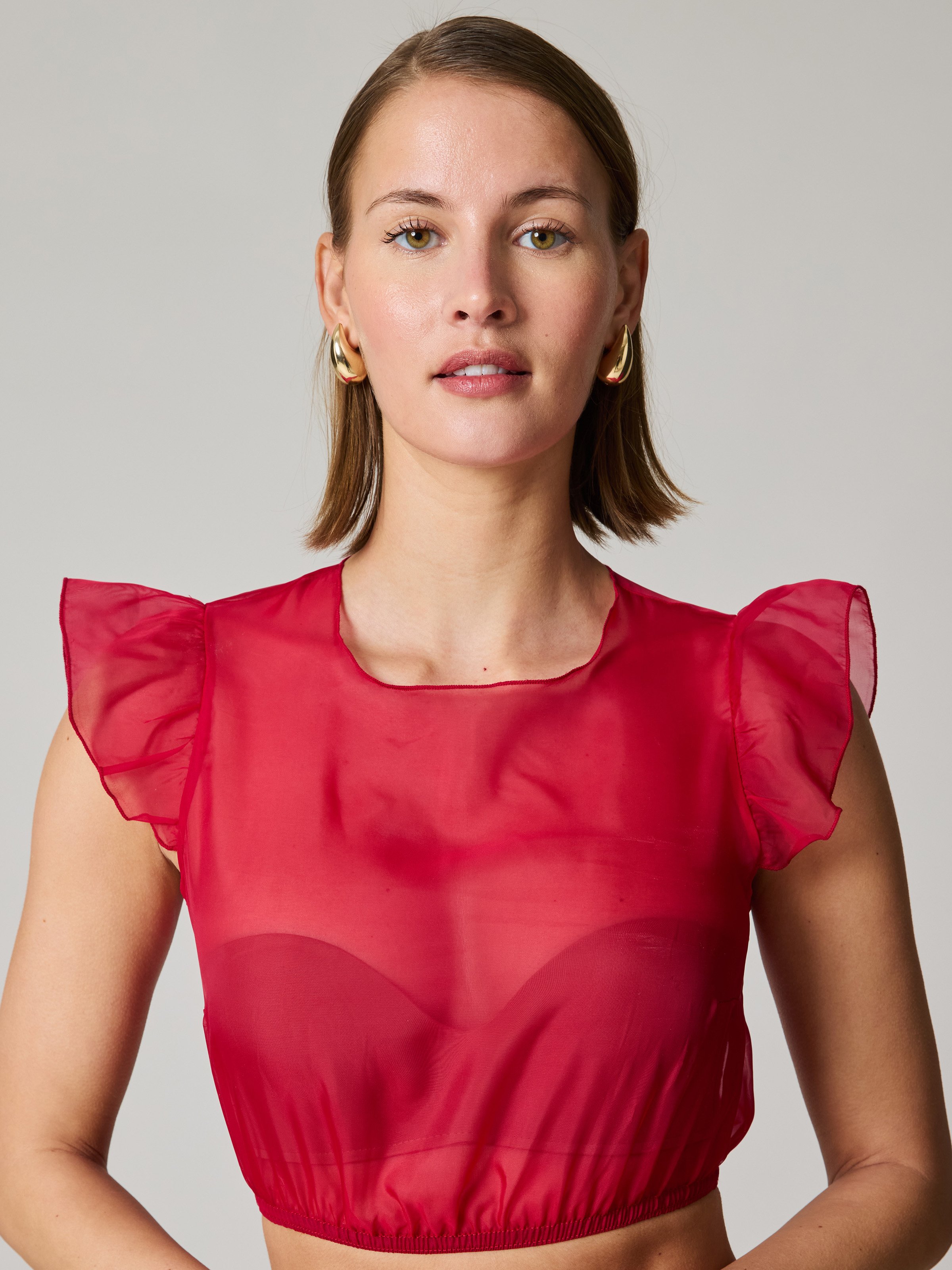 Transparente Bluse in Rot mit Flügelarm