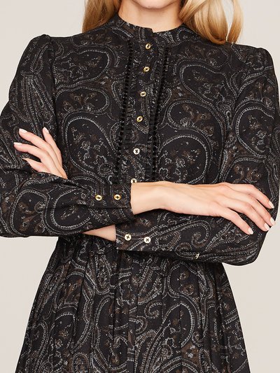 Schwarz gemustertes Blusenkleid mit Rüschen