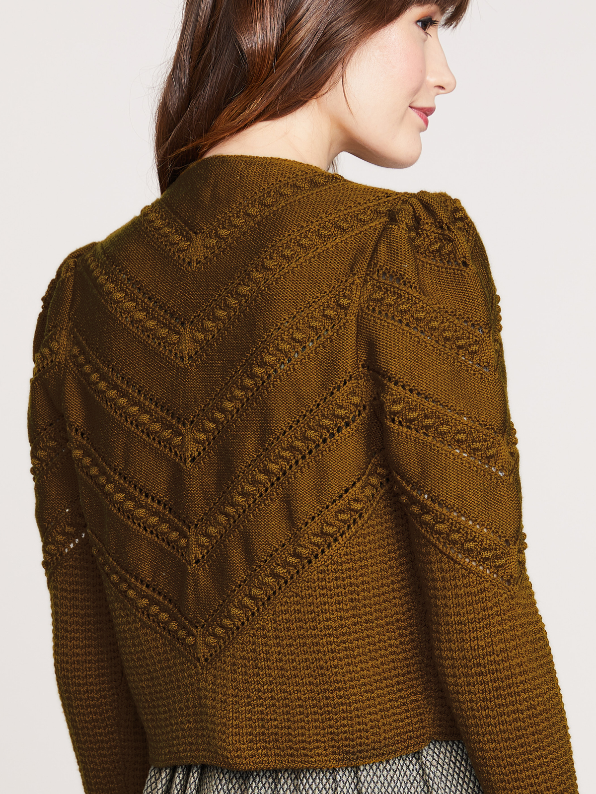 Kuschelige Strickjacke in Messing Kuschelige Strickjacke in Messing