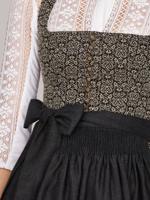 Gemustertes Dirndl in Erdtönen mit Leinen-Schürze Gemustertes Dirndl in Erdtönen mit Leinen-Schürze