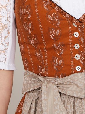 Senfgelbes Dirndl mit hellem Trachtenmuster Senfgelbes Dirndl mit hellem Trachtenmuster